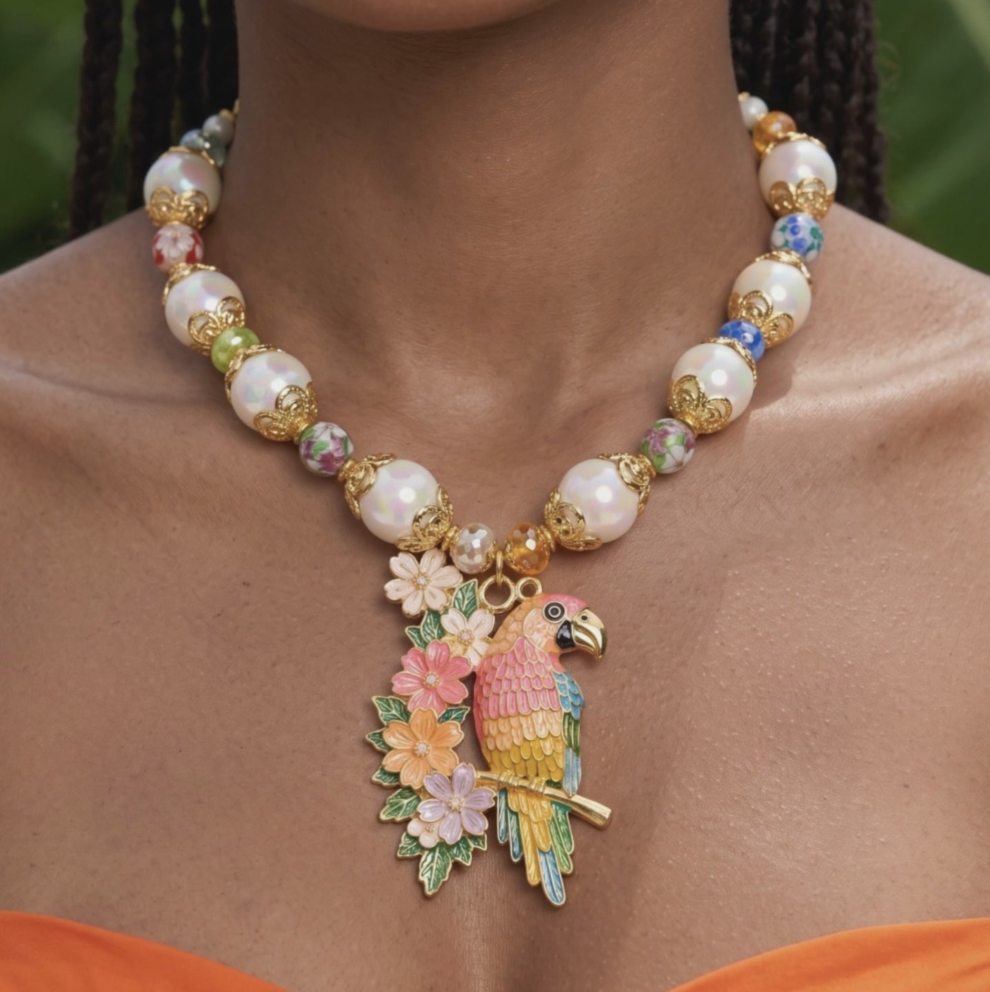 Sassy Jones tropical parrot statement necklace with colorful floral pendant and pearl inspired beads