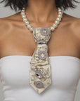 Close up of Valerie Pearl Queen necktie showcasing pearl centered jeweled motifs and sparkling crystal accents.