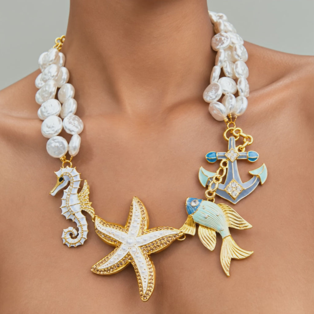 Harbor Grace nautical necklace with white baroque pearls, hand painted ocean charms and 18k gold plated accents.