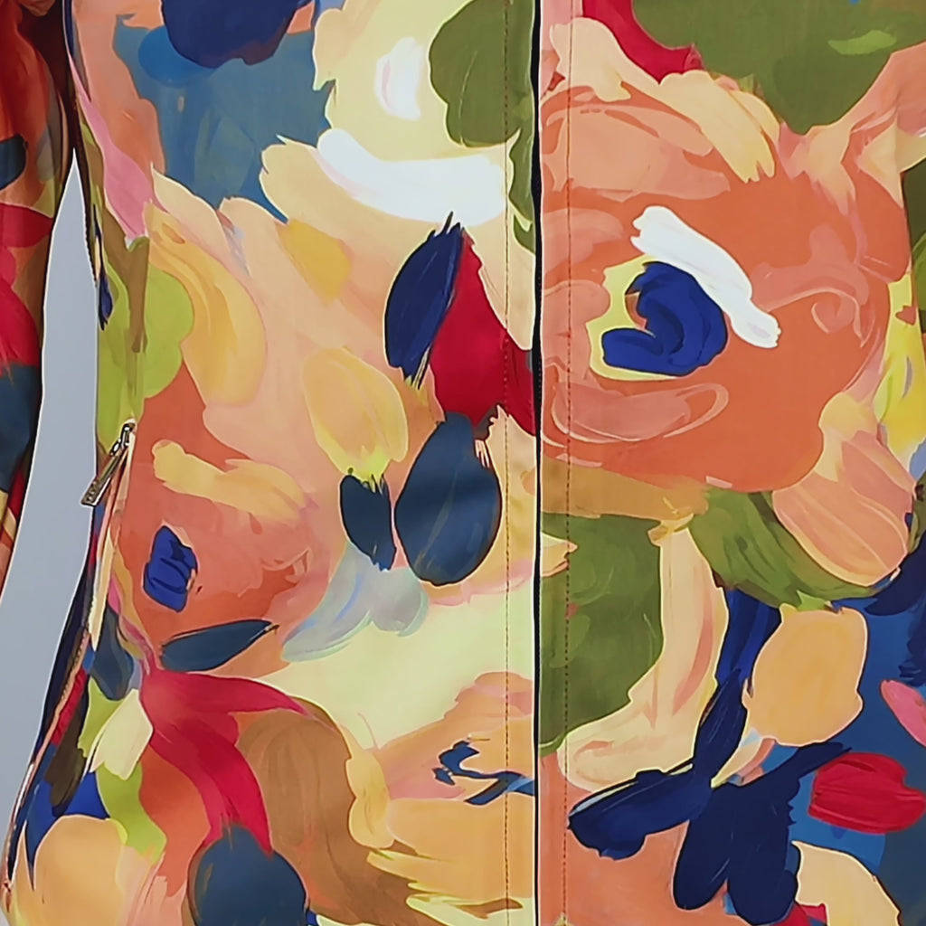 Multicolor stretch jacket featuring long sleeves, full front zipper, high collar and zippered side pockets.