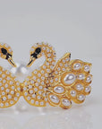 Luxury pearl bracelet featuring two jeweled swans with sparkling crystal bodies and dimensional pearl feather detailing