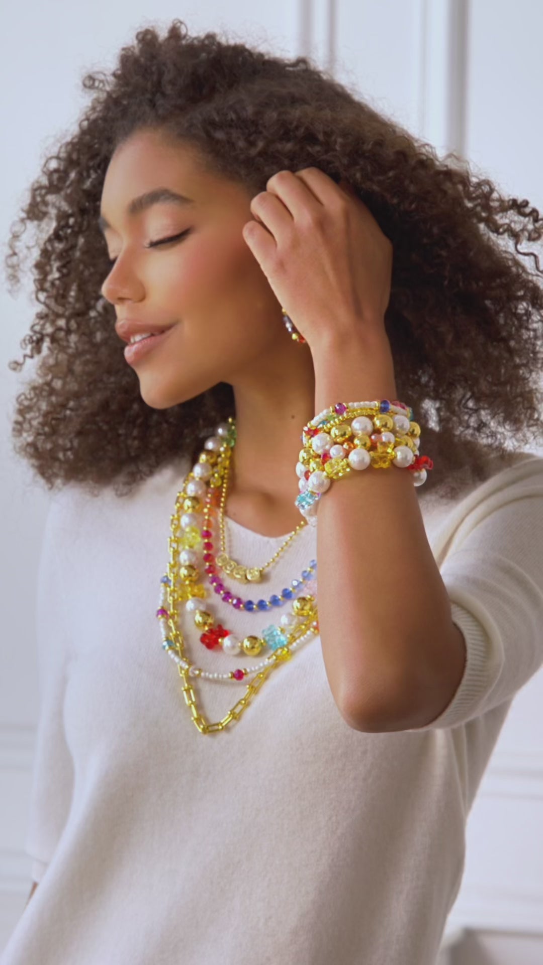 Colorful glass bead and pearl hoop earrings with gold accents designed for playful luxury styling