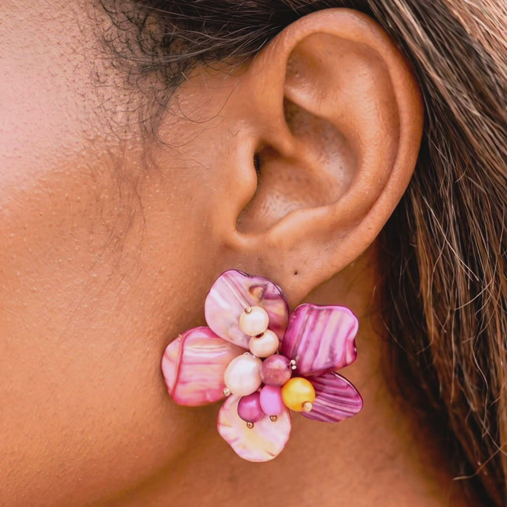 Wisteria Pink and Orange Abalone Earrings featuring sculptural flowers crafted from polished and wire woven mollusk shell petals.