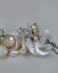 vory floral bracelet featuring dimensional natural shell blossoms, luminous pearls and intricate handcrafted detailing.