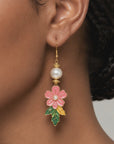 Sassy Jones Kalani tropical drop earrings featuring pink flowers, pearl inspired beads, and colorful leaf details