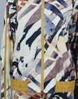 Close-up of women's Safari Ink jacket showing full front zipper, high collar and abstract neutral print.