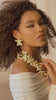 Gold floral dangle earrings with crystal centers and soft ivory drop accents in a honey toned elegant design.