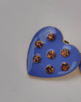 Blue heart stud earrings featuring a glossy finish, warm golden crystals and polished gold detailing.