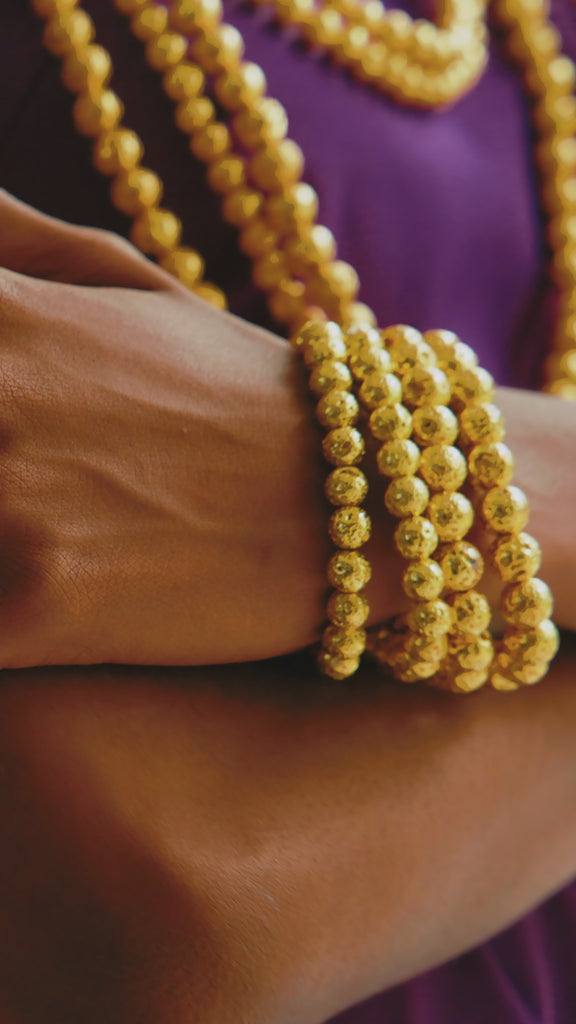 Makemba bracelet stack, golden lava bead bracelet, stretch bracelet stack, beaded gold bracelet, layered gold bracelet set, bold gold beaded jewelry, Makemba jewelry collection, golden hour bracelet, luxury beaded bracelet stack, statement bracelet set, lave bead jewelry, natural jewelry, handmade jewelry