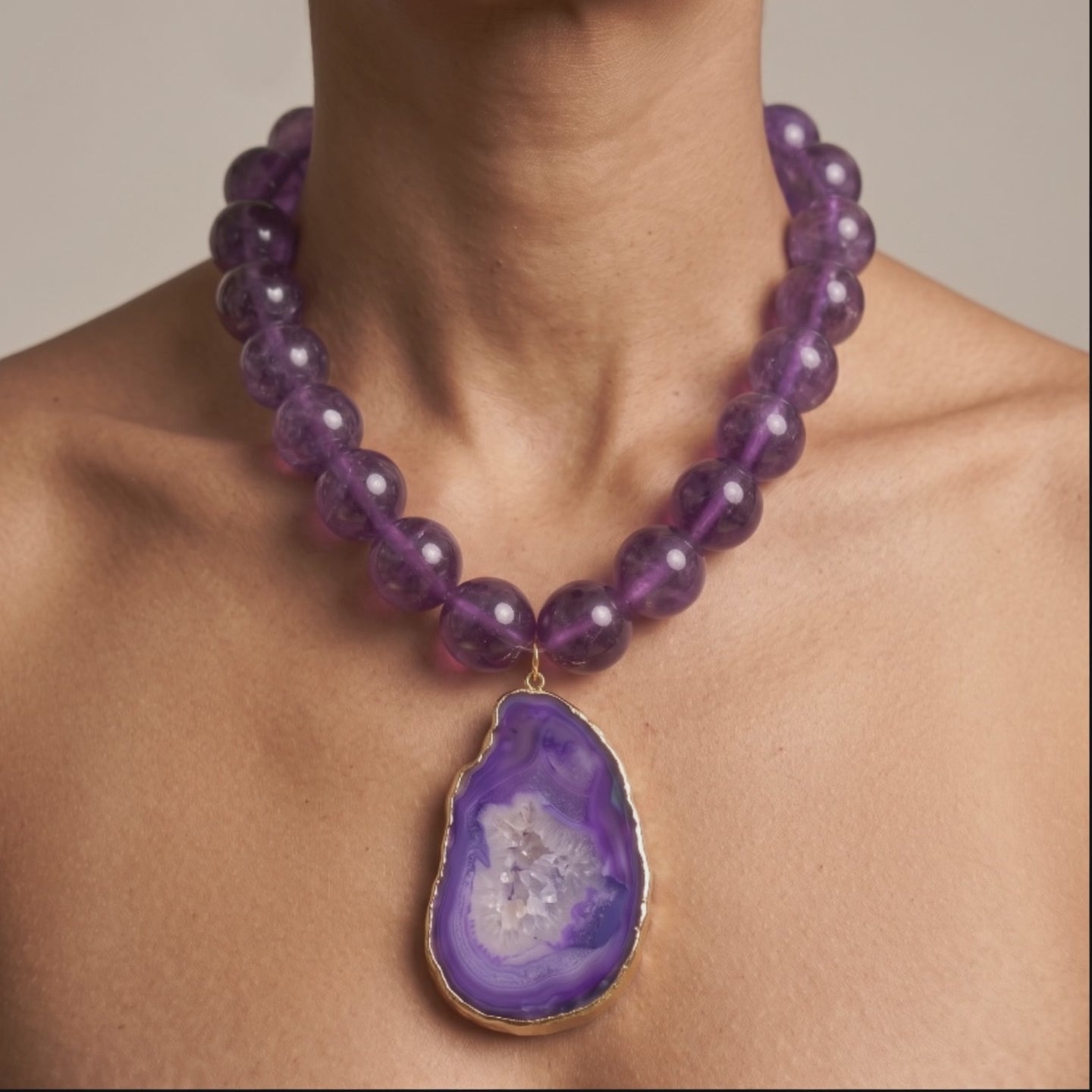Chrysallis necklace with translucent purple agate beads and natural sliced stone pendant with crystal druzy center.