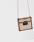 Luxury red lipstick trio with three velvety matte red shades and glittering gold clutch case with chain strap