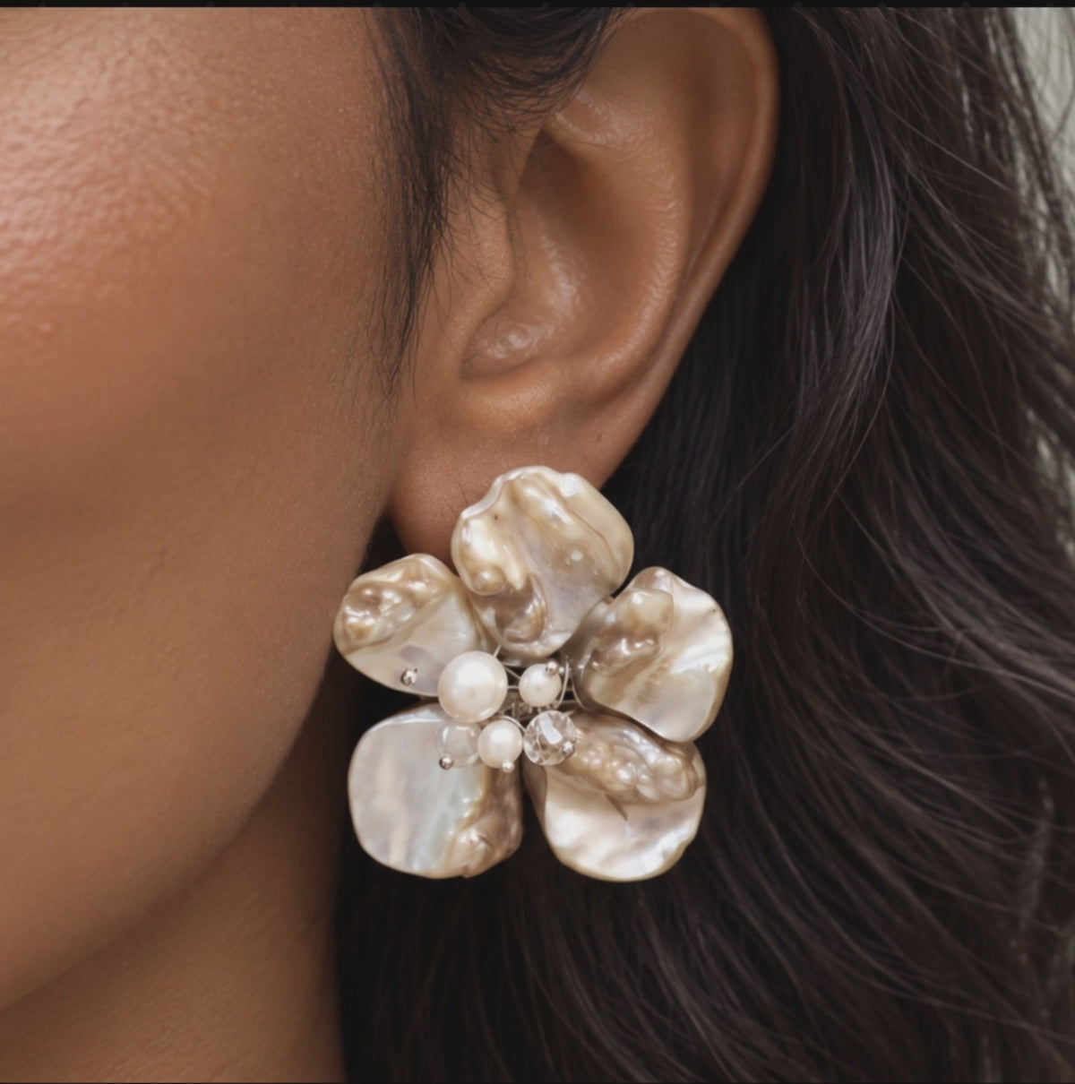 Ivory floral statement earrings featuring sculptural Mother of Pearl petals with pearl and clear faceted bead details.