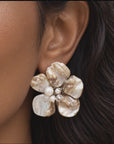 Ivory floral statement earrings featuring sculptural Mother of Pearl petals with pearl and clear faceted bead details.