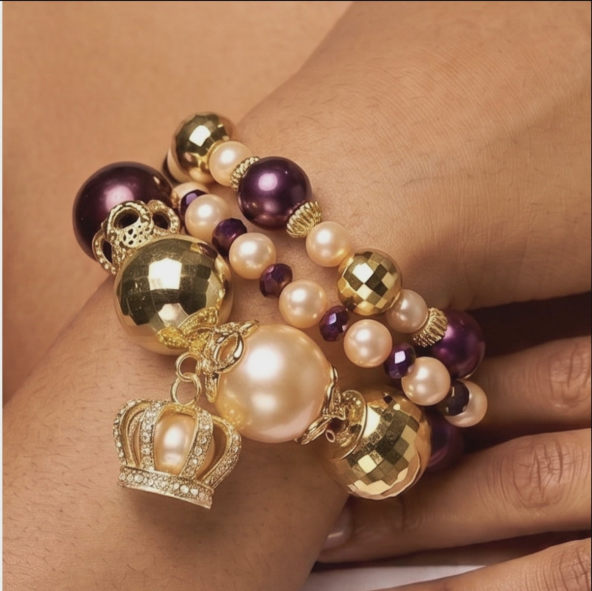  Sassy Jones Reign three-piece bracelet stack featuring champagne pearls, purple beads and 18K gold plated details.