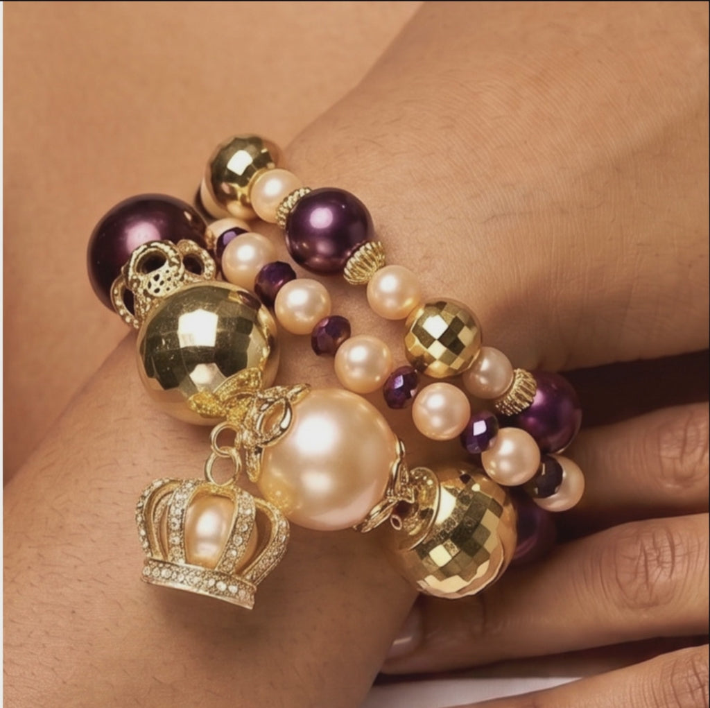  Sassy Jones Reign three-piece bracelet stack featuring champagne pearls, purple beads and 18K gold plated details.