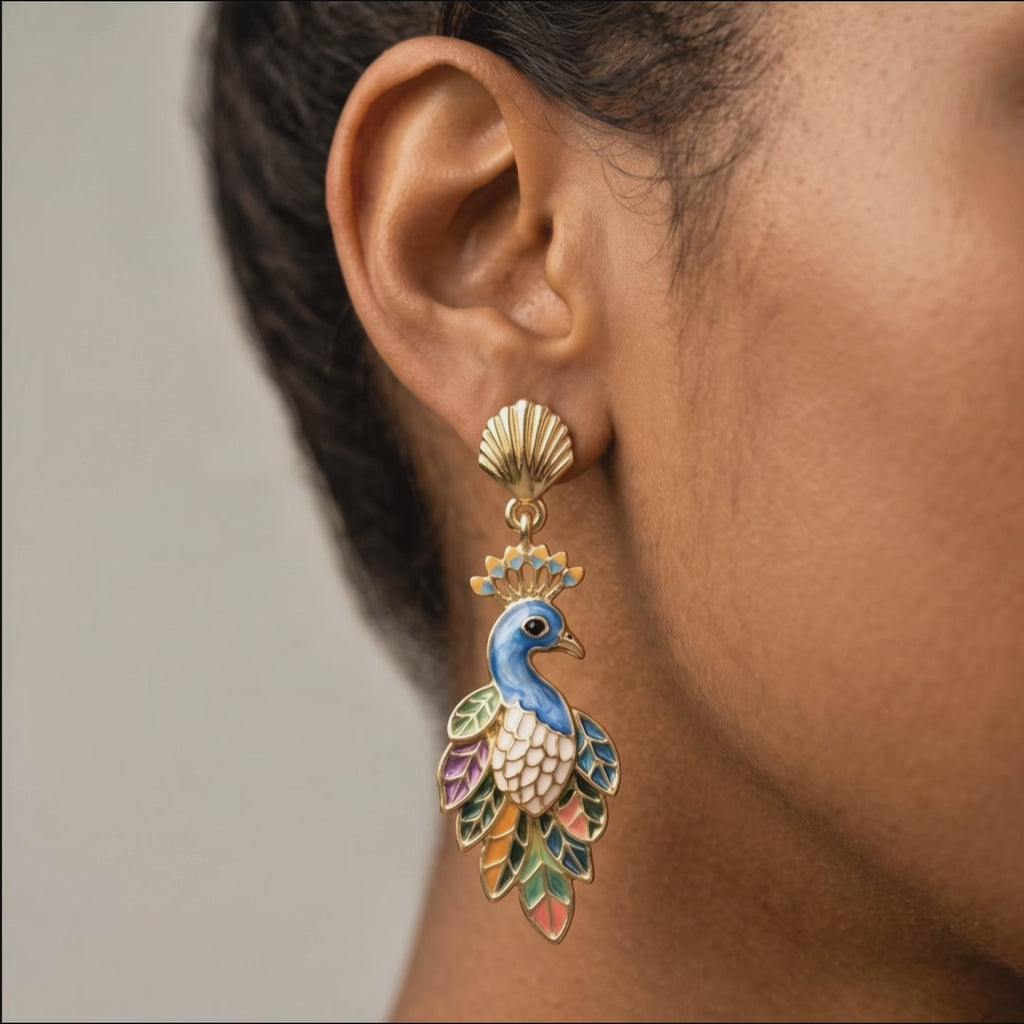 Victoriana statement earrings featuring crowned blue peacocks with layered multicolor feather detailing.
