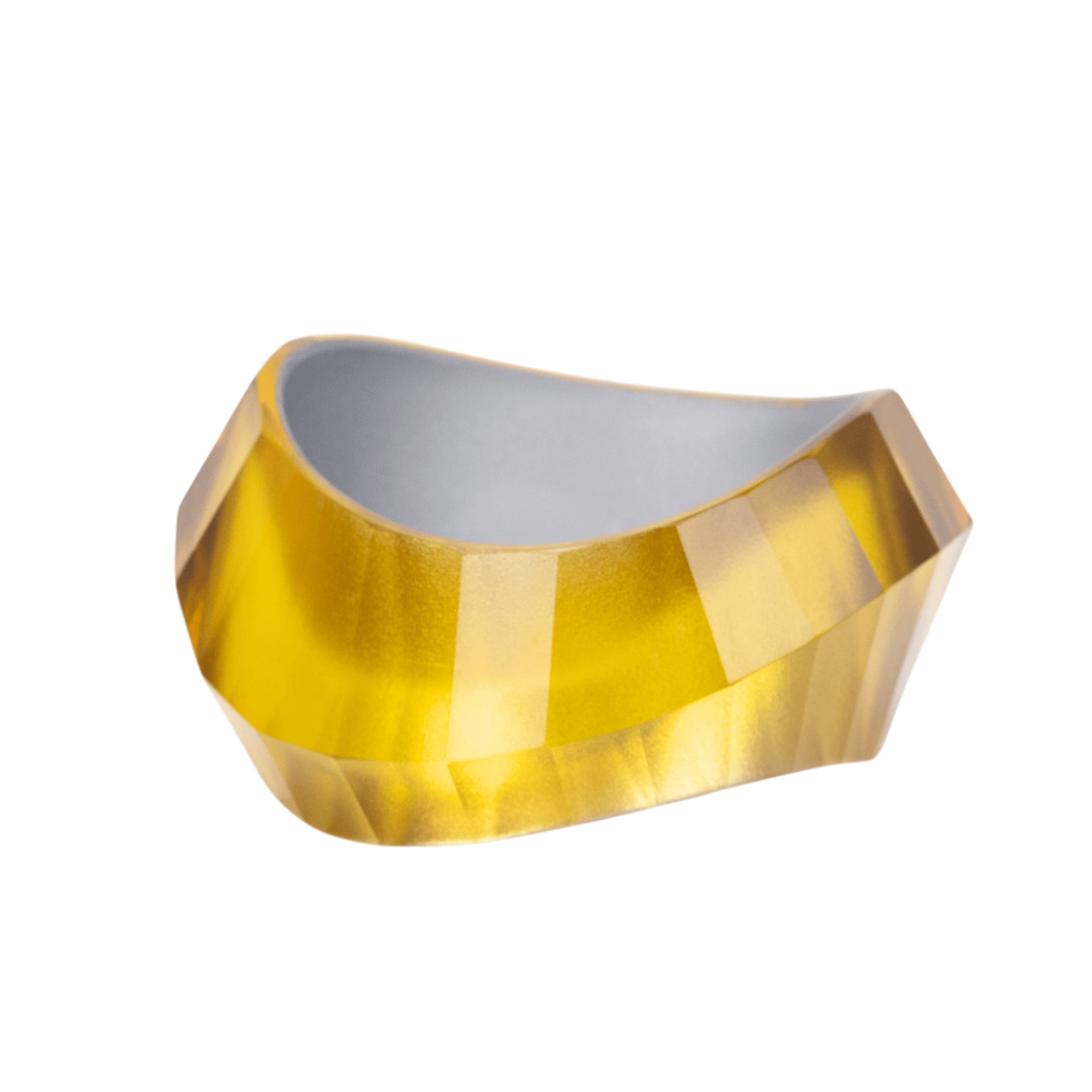 Faceted translucent golden resin bangle bracelet with sculptural modern shape on a white background.