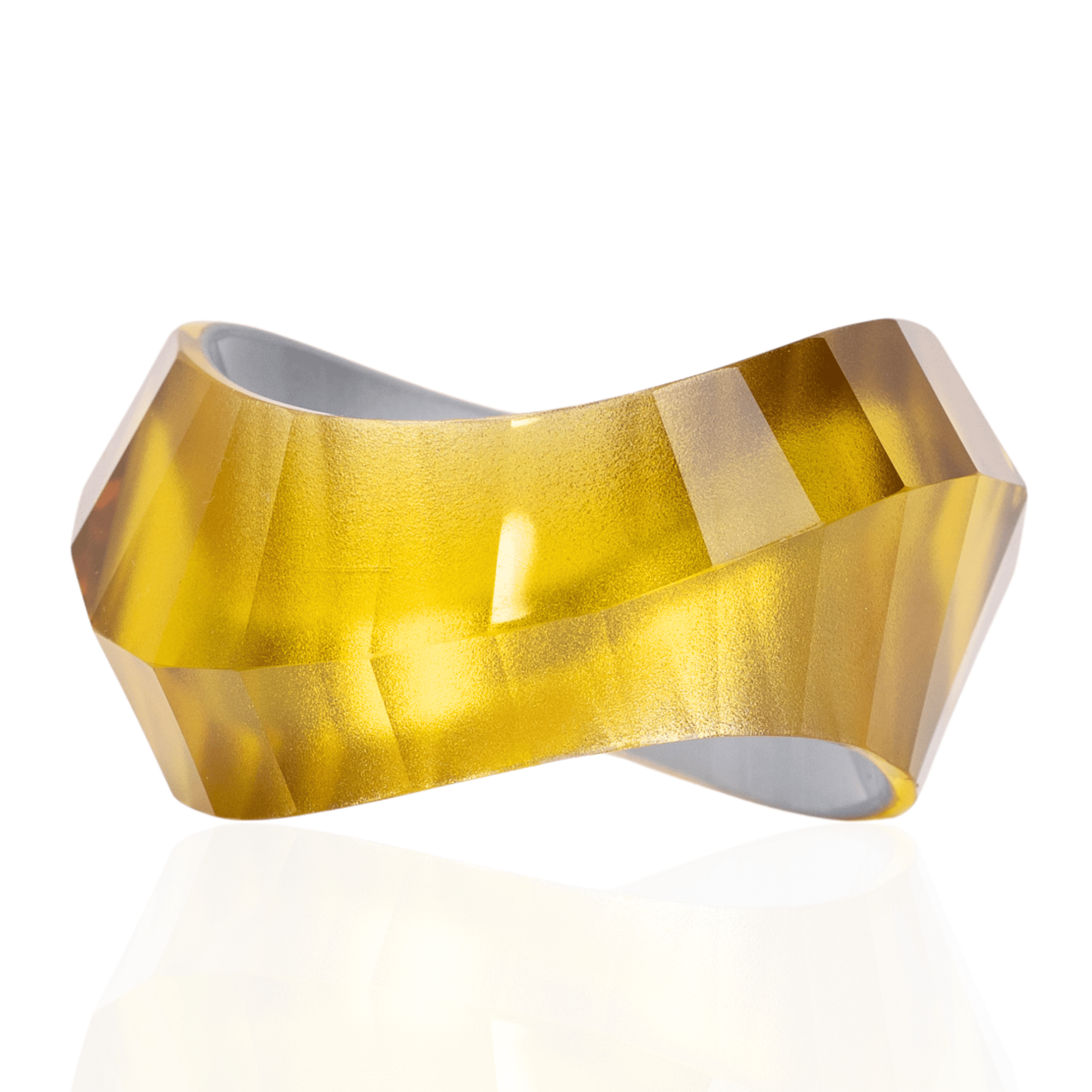 Faceted translucent golden resin bangle bracelet with sculptural modern shape on a white background.